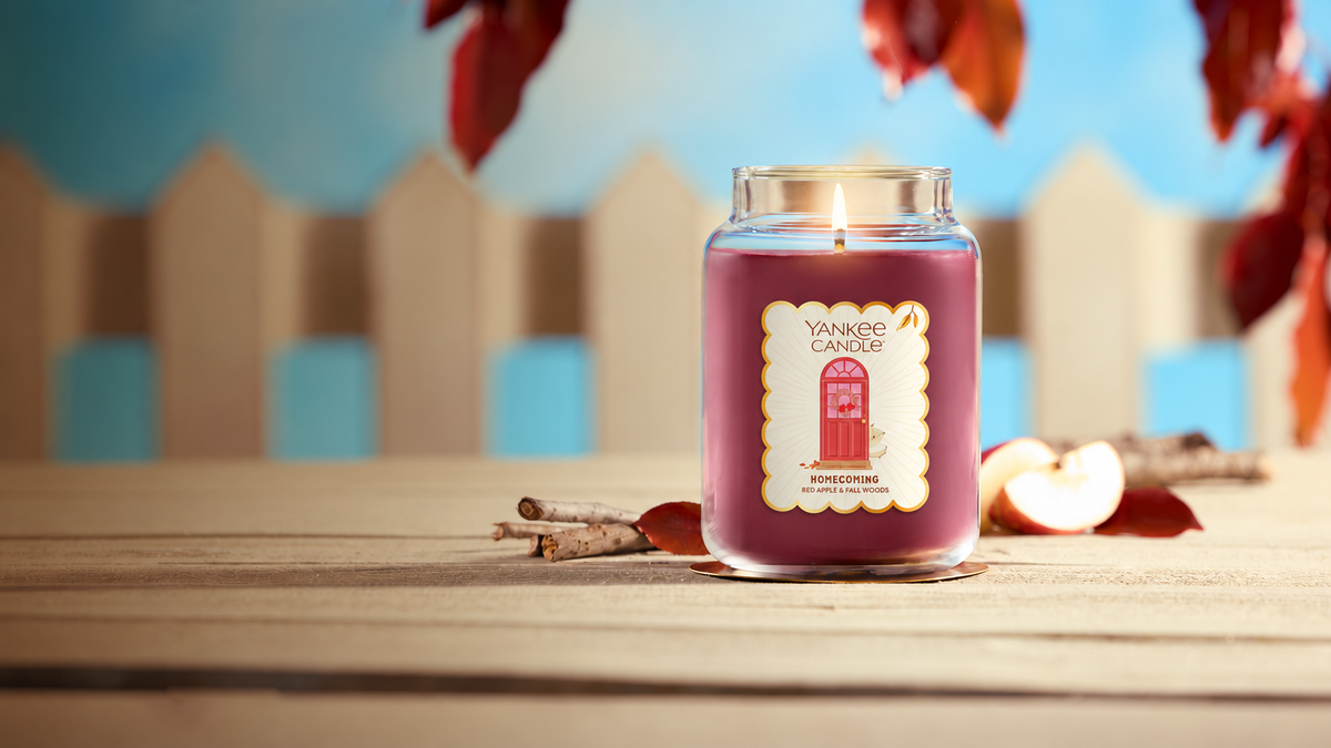 Autumn candle on a wooden table
